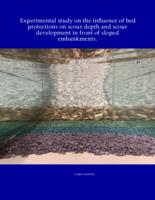 Experimental study on the influence of bed protections on scour depth and scour development in front of sloped embankments