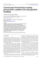Lateral nano-Newton force-sensing piezoresistive cantilever for microparticle handling