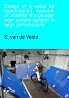 Design of a setup for experimental research on stability of a bicycle-rider system subject to large perturbations