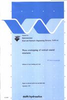 Wave overtopping of vertical coastal structures: Influence of wave breaking and wind