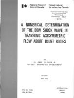 A numerical determination of the bow shock wave in transonic axisymetric flow about blunt bodies