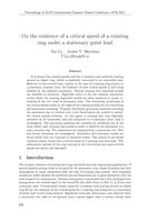 On the existence of a critical speed of a rotating ring under a stationary point load